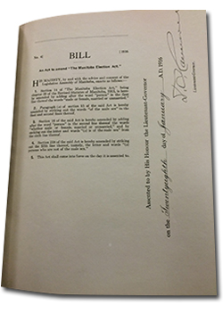 Photo of a page in Bill No. 4 showing An act to ammend The Manitoba Election Act. &ldquo;Assented to by His Honour the Lieutenant-Governor on the twenty-eighth day of January A.D. 1916.&rdquo; Signed by the Lieutenant-Governor.