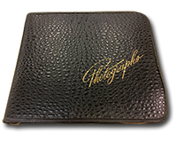 Front cover of leather book of photographs embossed with the word &ldquo;Photographs&rdquo;